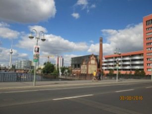 A group of buildings on the Spree. The Wahlplakate, or political campaign posters, are scattered around the city like weeds. Elections are on the 16th of September.